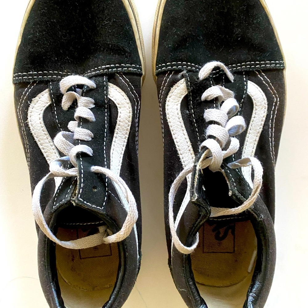 Perfectly worn in women’s Classic Black & White Vans